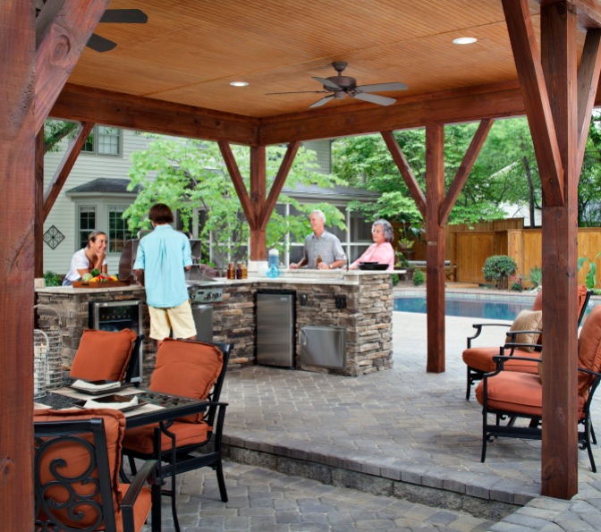 Archadeck of Charlotte designed and built this covered outdoor kitchen with a cabana and all of the outdoor appliances including a Fire Magic AOG Grill